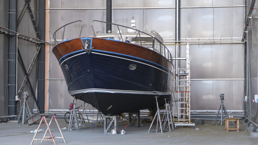 Photograph of a boat in a garage